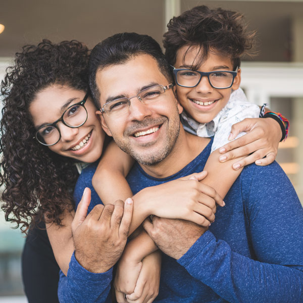 family in glasses smiling