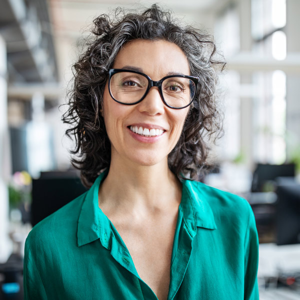 woman in glasses smiling